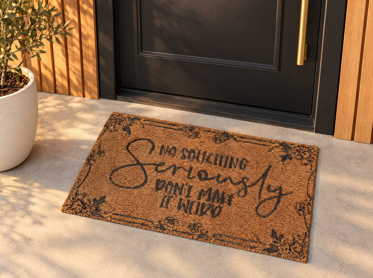 No Soliciting Seriously Don't Make It Weird doormat on a modern front porch